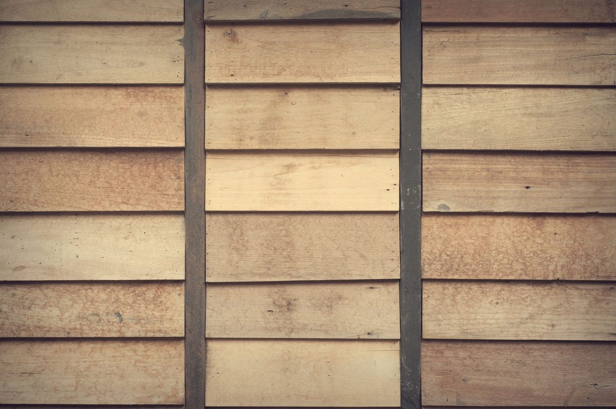 Close-up view of natural wood slat wall cladding showing grain and finish