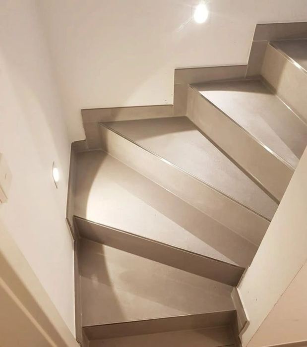Dramatic top-down view of a winding stone staircase