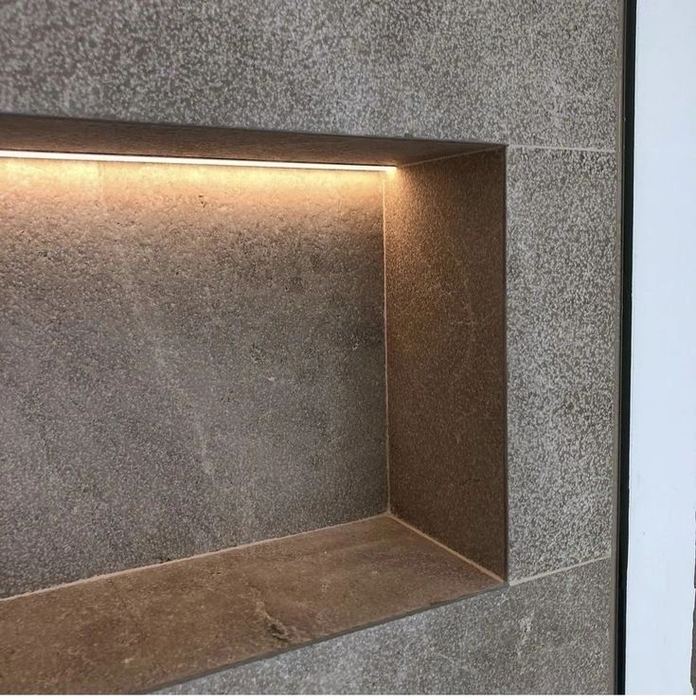 Stone wall niche with a mitred join and warm hidden LED strip